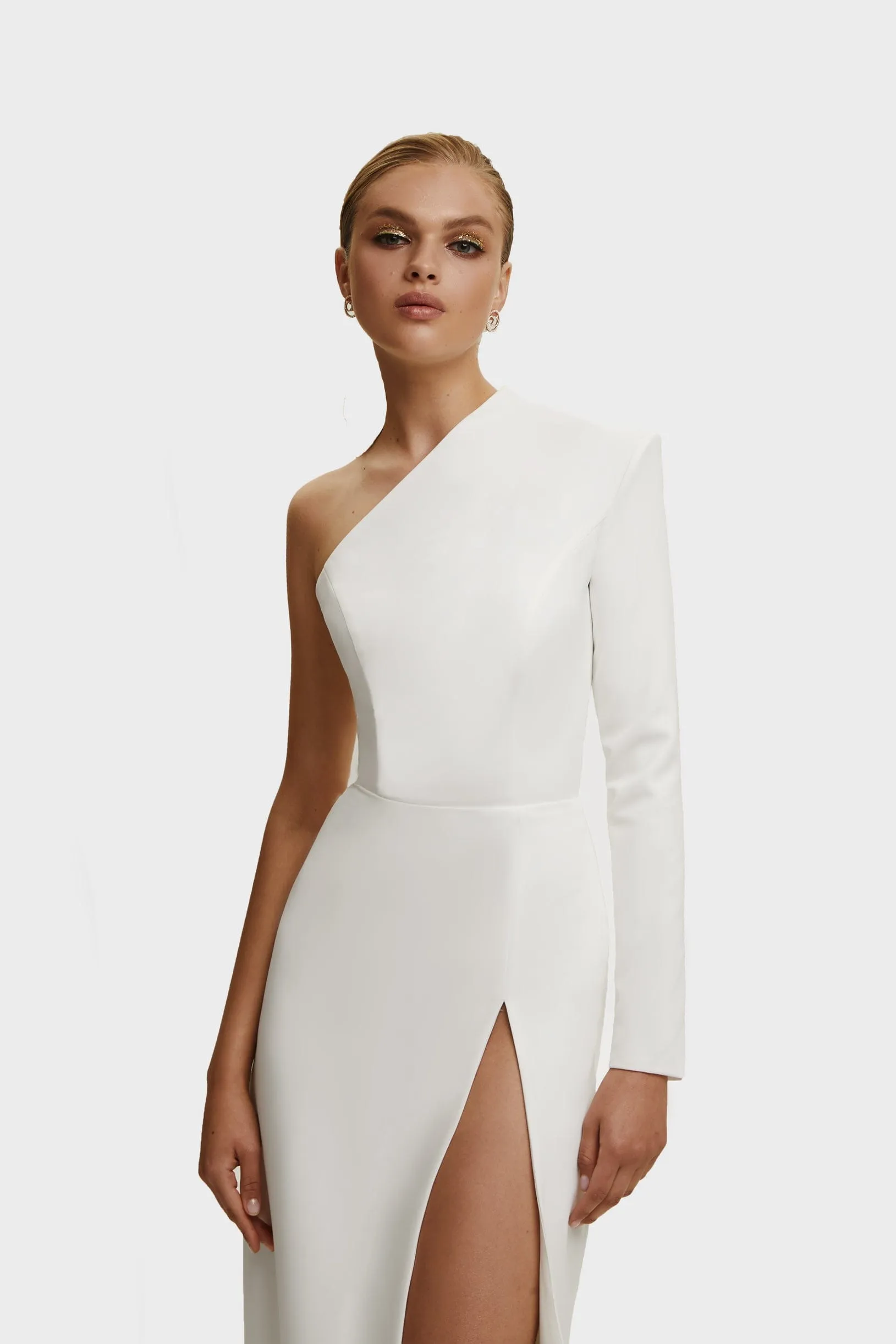 White Long-sleeved dress with sharp shoulder cut