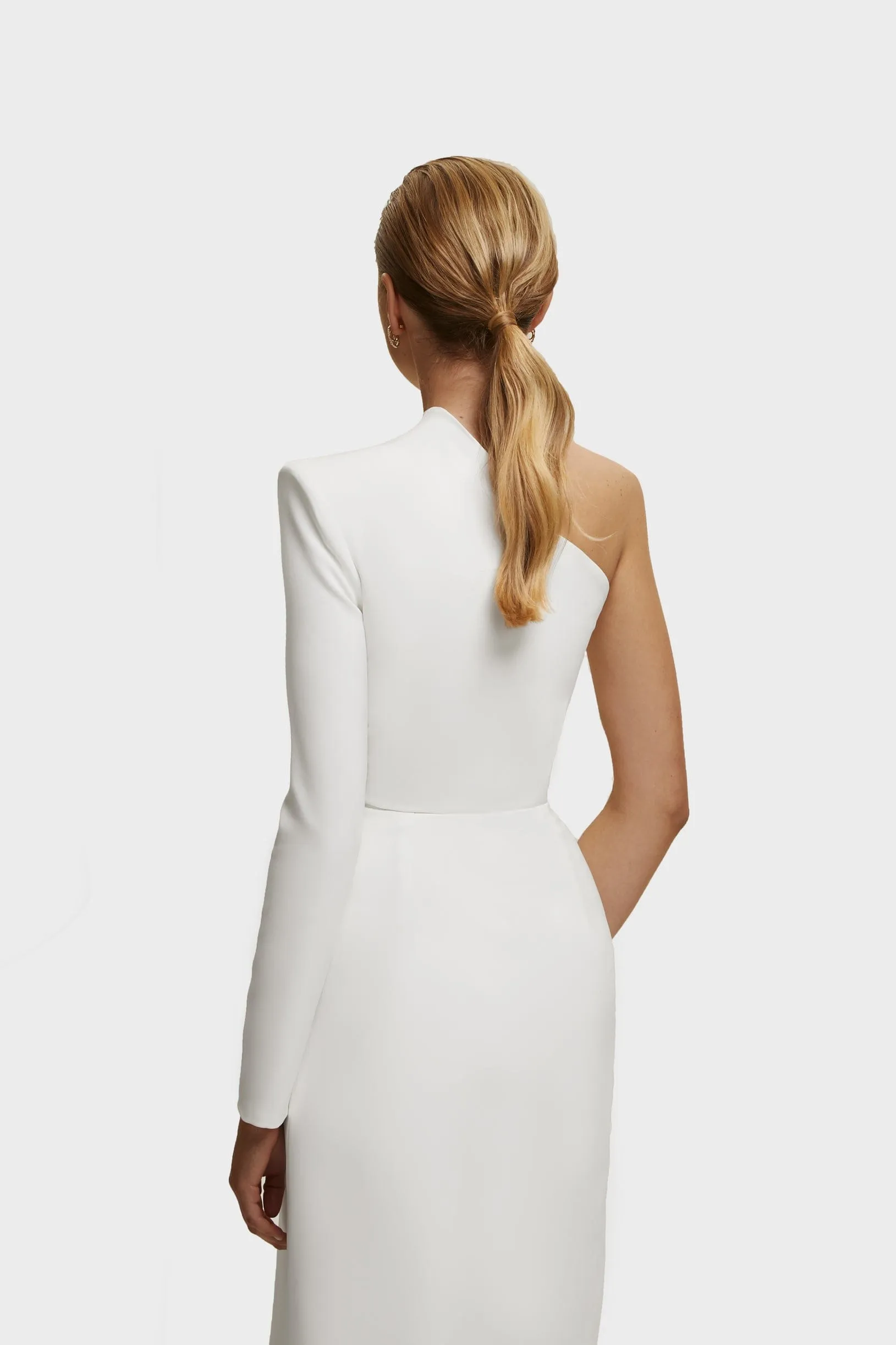 White Long-sleeved dress with sharp shoulder cut